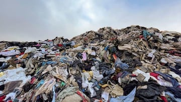 View of used clothes discarded in the Atacama desert, in Alto Hospicio, Iquique, Chile, on September 26, 2021. - EcoFibra, Ecocitex and Sembra are circular economy projects that have textile waste as their raw material. The textile industry in Chile will be included in the law of Extended Responsibility of the Producer (REP), forcing clothes and textiles importers take charge of the waste they generate. (Photo by MARTIN BERNETTI / AFP) (Photo by MARTIN BERNETTI/AFP via Getty Images)