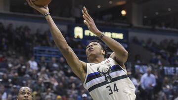 Mar 2, 2018; Milwaukee, WI, USA; Milwaukee Bucks forward Giannis Antetokounmpo (34) takes a shot against Indiana Pacers forward Thaddeus Young (21) in the third quarter at the BMO Harris Bradley Center. Mandatory Credit: Benny Sieu-USA TODAY Sports