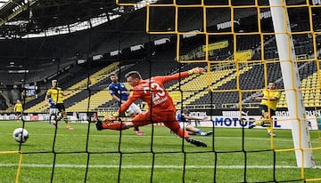 Soccer Football - Bundesliga - Borussia Dortmund v Schalke 04 - Signal Iduna Park, Dortmund, Germany - May 16, 2020 Dortmund's Raphael Guerreiro scores their second goal as play resumes behind closed doors following the outbreak of the coronavirus disease