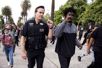 LAPD Commander Cory Palka and a protester