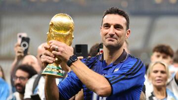 LUSAIL CITY, QATAR - DECEMBER 18: Lionel Scaloni, Head Coach of Argentina, celebrates with the FIFA World Cup Qatar 2022 Winner's Trophy after the FIFA World Cup Qatar 2022 Final match between Argentina and France at Lusail Stadium on December 18, 2022 in Lusail City, Qatar. (Photo by Julian Finney/Getty Images)