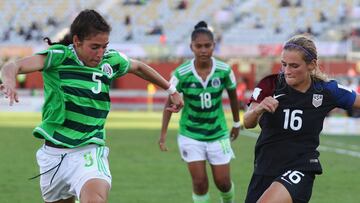 PORT MORESBY, PAPUA NEW GUINEA - NOVEMBER 25:  Monica Flores of Mexico tries to tackle Emily Fox of United States during the FIFA U-20 Women's World Cup, Quarter Final match between USA and Mexico at Sir John Guise Stadium on November 25, 2016 in Port Moresby, Papua New Guinea.  (Photo by Ian Walton - FIFA/FIFA via Getty Images)