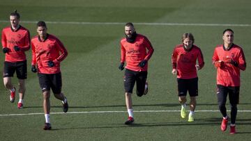Real Madrid's Karim Benzema, center, runs with some of his teammates during a training session in Madrid, Spain, Tuesday Dec. 11, 2018. Real Madrid will play CSKA Moscow Wednesday in a Group G Champions League soccer match. From left, Gareth Bale, Ra