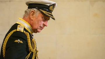 Britain's King Charles III, arrives for a vigil around the coffin of Queen Elizabeth II, draped in the Royal Standard with the Imperial State Crown and the Sovereign's orb and sceptre, lying in state on the catafalque in Westminster Hall, at the Palace of Westminster in London on September 16, 2022, ahead of her funeral on Monday. - Queen Elizabeth II will lie in state in Westminster Hall inside the Palace of Westminster, until 0530 GMT on September 19, a few hours before her funeral, with huge queues expected to file past her coffin to pay their respects. (Photo by Dominic Lipinski / POOL / AFP) (Photo by DOMINIC LIPINSKI/POOL/AFP via Getty Images)