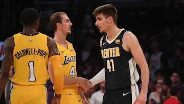 Oct 2, 2017; Los Angeles, CA, USA; Denver Nuggets forward Juan Hernangomez (41) and Los Angeles Lakers guard Alex Caruso (4) shake hands after their game at Staples Center as Lakers guard Kentavious Caldwell-Pope (1) looks on. Mandatory Credit: Richard Mackson-USA TODAY Sports