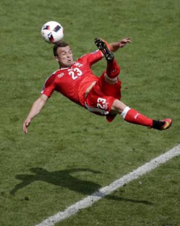 Xherdan Shaqiri of Switzerland scores what's likely to be the goal of the tournament at the end of the 1-1 draw with Poland.