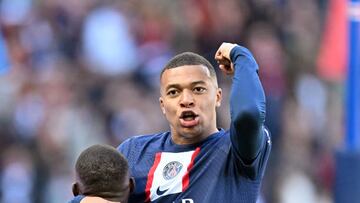 PARIS, FRANCE - NOVEMBER 13:  Kylian Mbappe of Paris Saint - Germain  celebrates with Nuno Mendes after scoring during the French Ligue 1 (L1) soccer match between Paris Saint-Germain (PSG) and AJ Auxerre at Parc des Princes stadium in Paris, France on November 13, 2022. (Photo by Mustafa Yalcin/Anadolu Agency via Getty Images)