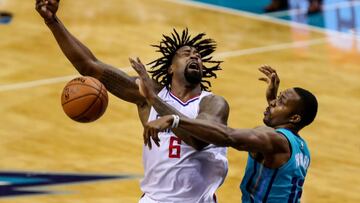 Nov 18, 2017; Charlotte, NC, USA; Charlotte Hornets center Dwight Howard (12) gets the ball away from LA Clippers center DeAndre Jordan (6) during the second quarter at Spectrum Center. Mandatory Credit: Jim Dedmon-USA TODAY Sports