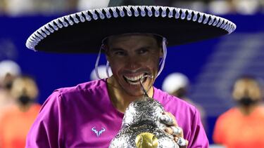 Tennis - ATP 500 - Abierto Mexicano - The Fairmont Acapulco Princess, Acapulco, Mexico - February 26, 2022 Spain's Rafael Nadal celebrates with the trophy after winning the final REUTERS/Henry Romero