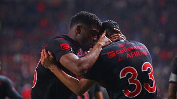 Emanuel Reynoso celebrates his goal 3-0 with Jose Zuniga of Tijuana during the Quarter final first leg round match between Tijuana and Cruz Azul as part of the Liga BBVA MX, Torneo Apertura 2024 at Caliente Stadium on November 27, 2024 in Tijuana, Baja California, Mexico.