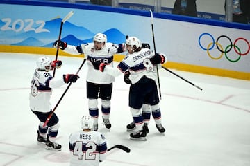 USA's players celebrate after scoring a goal during the men's preliminary round group A match of the Beijing 2022 Winter Olympic Games ice hockey competition between Canada and USA, at the National Indoor Stadium in Beijing on February 12, 2022. (Photo by