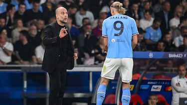 Manchester City's Spanish manager Pep Guardiola speaks with Manchester City's Norwegian striker #9 Erling Haaland during the UEFA Champions League final football match between Inter Milan and Manchester City at the Ataturk Olympic Stadium in Istanbul, on June 10, 2023. (Photo by FRANCK FIFE / AFP)