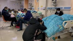 Patients with Covid-19 lay in beds at Tangshan Gongren Hospital in China's northeastern city of Tangshan on December 30, 2022. (Photo by Noel Celis / AFP) (Photo by NOEL CELIS/AFP via Getty Images)