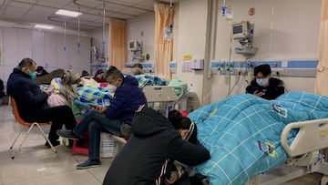 Patients with Covid-19 lay in beds at Tangshan Gongren Hospital in China's northeastern city of Tangshan on December 30, 2022. (Photo by Noel Celis / AFP) (Photo by NOEL CELIS/AFP via Getty Images)