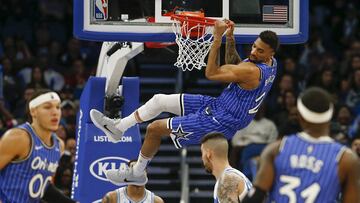 Feb 14, 2019; Orlando, FL, USA; (Editors Notes: Caption Correction) Orlando Magic center Khem Birch (24) hangs on the basket following a dunk during the second half against the Charlotte Hornets at Amway Center. Mandatory Credit: Reinhold Matay-USA TODAY Sports