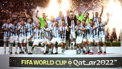 FILE PHOTO: Soccer Football - FIFA World Cup Qatar 2022 - Final - Argentina v France - Lusail Stadium, Lusail, Qatar - December 18, 2022 Argentina's Lionel Messi celebrates with the trophy and teammates after winning the World Cup REUTERS/Carl Recine/File Photo