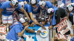 Kansas Jayhawks place their logo on the March Madness tournament ticket after the game against the Texas Tech Red Raiders at T-Mobile Center. 