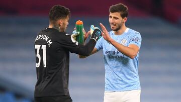 Manchester (United Kingdom), 05/12/2020.- Ederson of Manchester City (L) greets team mate Ruben Dias (R) at the end of the English Premier League soccer match between Manchester City and Fulham FC in Manchester, Britain, 05 December 2020. (Reino Unido) EF