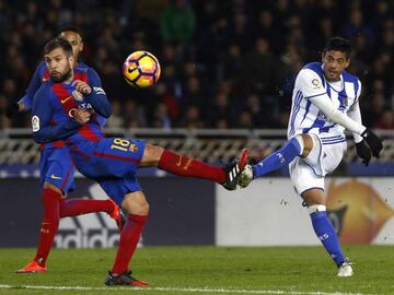 Jordi Alba battles with Carlos Vela during the game on Sunday night.