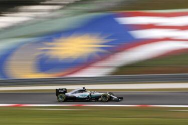 Hamilton blazes to pole and sets new lap record at Sepang