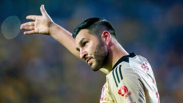 Tigres' French forward Andre-Pierre Gignac (L) celebrates after scoring against Tijuana during their Mexican Clausura 2024 football tournament match at the Universitario stadium in Monterrey, Mexico, on April 27, 2024. (Photo by Julio Cesar AGUILAR / AFP)