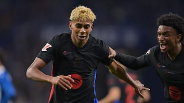 Barcelona's Spanish forward #19 Lamine Yamal celebrates scoring his team's first goal with teammate Barcelona's Spanish defender #03 Alex Balde during the Spanish league football match between RCD Espanyol and FC Barcelona at�the RCDE Stadium in Cornella de Llobregat, on May 15, 2025. (Photo by MANAURE QUINTERO / AFP)