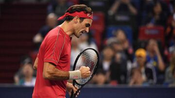Roger Federer of Switzerland celebrates a point against Albert Ramos of Spain during their second round men's singles match at the Shanghai Masters tennis tournament in Shanghai on October 8, 2019. (Photo by HECTOR RETAMAL / AFP)