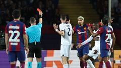 Romanian referee Istvan Kovacs gives a red card to Barcelona's Uruguayan defender #04 Ronald Araujo during the UEFA Champions League quarter-final second leg football match between FC Barcelona and Paris SG at the Estadi Olimpic Lluis Companys in Barcelona on April 16, 2024. (Photo by FRANCK FIFE / AFP)