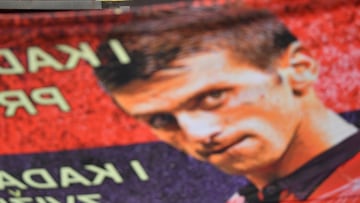 Supporters unfurl a banner outside the Park hotel quarantine facility where it is believed Serbian tennis player Novak Djokovic is being detained in Melbourne, Friday, January 7, 2022. World No.1 tennis star Novak Djokovic is fighting his visa cancellatio