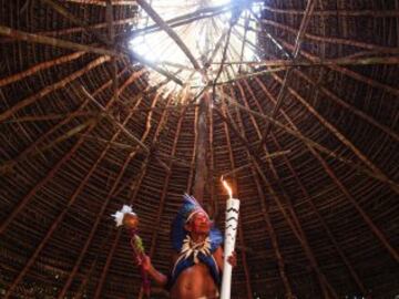 Shaman Raimundo of the Desana tribe, who live in the Amazon jungle. with the Olympic torch.