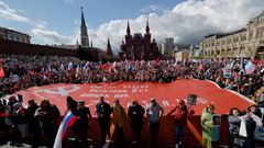 FILE PHOTO: People hold a banner as they attend the Immortal Regiment march on Victory Day, which marks the 77th anniversary of the victory over Nazi Germany in World War Two, in central Moscow, Russia May 9, 2022. REUTERS/Maxim Shemetov/File Photo