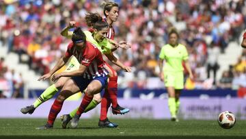 Meseguer y Vicky Losada en un duelo entre Atl&eacute;tico y Barcelona. 