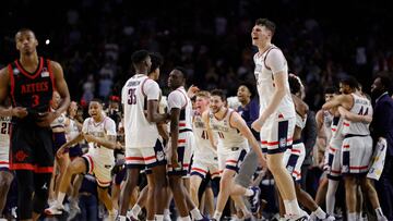 HOUSTON, TEXAS - APRIL 03: Alex Karaban #11 of the Connecticut Huskies celebrates with teammates after defeating the San Diego State Aztecs 76-59 during the NCAA Men's Basketball Tournament National Championship game at NRG Stadium on April 03, 2023 in Houston, Texas.   Carmen Mandato/Getty Images/AFP (Photo by Carmen Mandato / GETTY IMAGES NORTH AMERICA / Getty Images via AFP)