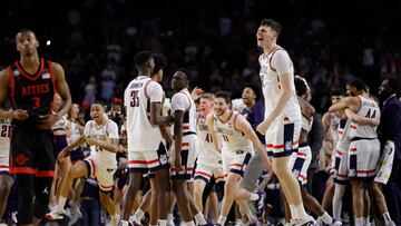 HOUSTON, TEXAS - APRIL 03: Alex Karaban #11 of the Connecticut Huskies celebrates with teammates after defeating the San Diego State Aztecs 76-59 during the NCAA Men's Basketball Tournament National Championship game at NRG Stadium on April 03, 2023 in Houston, Texas. Carmen Mandato/Getty Images/AFP (Photo by Carmen Mandato / GETTY IMAGES NORTH AMERICA / Getty Images via AFP)