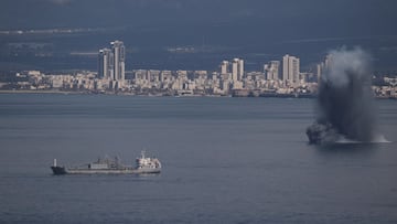 An incoming projectile explodes over the water as Israel issues a nationwide alert following its strikes on Iran, in Haifa Bay, northern Israel, Saturday, Feb. 28, 2026. (AP Photo/Leo Correa)