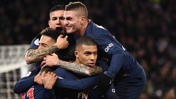 Paris Saint-Germain's French forward Kylian Mbappe is congratulated by teammates after scoring a goal during the French L1 football match Paris Saint-Germain (PSG) vs Olympique de Marseille (OM), on March 17, 2019 at the Parc des Princes stadium in P