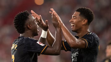 Real Madrid's Brazilian forward #07 Vinicius Junior (L) celebrates scoring his team's third goal, with Real Madrid's English midfielder #5 Jude Bellingham, during the Spanish Liga football match between UD Almeria and Real Madrid CF at the Municipal Stadium of the Mediterranean Games in Almeria on August 19, 2023. (Photo by JORGE GUERRERO / AFP)