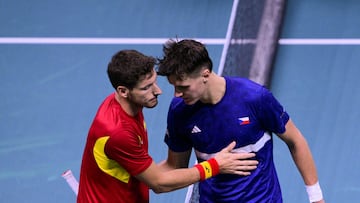 Czech Republic's Jakub Mensik (R) greets Spain's Pablo Carreno Busta after winning their Davis Cup men's singles quarter finals tennis match, at the Super Tennis Arena, in Bologna, northen Italy, on November 20, 2025. (Photo by Tiziana FABI / AFP)