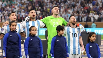 LUSAIL CITY, QATAR - DECEMBER 18: Emiliano Martinez and Lionel Messi of Argentina sing their national anthem prior to the FIFA World Cup Qatar 2022 Final match between Argentina and France at Lusail Stadium on December 18, 2022 in Lusail City, Qatar. (Photo by Clive Brunskill/Getty Images)