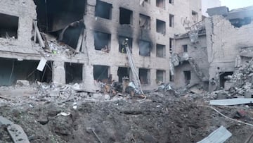 Firefighters work at their destroyed fire depot compound belonging to the State Emergency Service, after a Russian missile strike, in Dnipro, Ukraine May 22, 2023 in this still image taken from handout video. Press service of the State Emergency Service of Ukraine in Dnipropetrovsk region/Handout via REUTERS ATTENTION EDITORS - THIS IMAGE HAS BEEN SUPPLIED BY A THIRD PARTY.