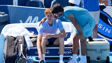 Aug 18, 2025; Cincinnati, OH, USA; Jannik Sinner (ITA), left, talks with Carlos Alcaraz (ESP) after retiring from their match during the Cincinnati Open at the Lindner Family Tennis Center. Mandatory Credit: Aaron Doster-Imagn Images