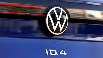 A new Volkswagen (VW) ID.4 SUV electric automobile is seen at the customer centre of German carmaker Volkswagen in Wolfsburg, northern Germany on March 26, 2021. - German auto giant Volkswagen said it is aiming to dominate the electric car market by 2025 