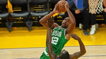 Boston Celtics center Al Horford shoots the ball against Golden State Warriors forward Draymond Green in Game 1 on Thursday.