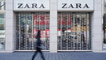 FILED - 18 March 2020, Baden-Wuerttemberg, Mannheim: A pedestrian walks past a closed Zara branch amid rising fears of the Coronavirus outbreak. Inditex, the Spanish owner of Zara has announced the closure of 3,785 stores globally