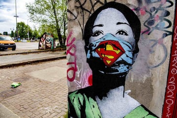 Graffiti Super Nurse by artist FAKE on April 26, 2020 in Amsterdam, Netherlands. Street art on a wall of the former NDSM shipyard in the north of Amsterdam symbolize the current worldwide coronavirus crisis