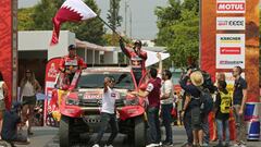 Dakar Rally - 2018 Peru-Bolivia-Argentina Dakar rally - 40th Dakar Edition - January 6, 2018 -  Toyota Gazoo Racing SA team driver Nasser Al-Attiyah of Qatar (R) and co-driver Matthieu Baumel of France wave on the podium during the departure ceremony in L