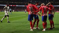 Atletico Madrid's French forward #07 Antoine Griezmann is congratulated for scoring his team's second goal during the Spanish Liga football match between Club Atletico de Madrid and Real Madrid CF at the Metropolitano stadium in Madrid on September 24, 2023. (Photo by Oscar del Pozo / AFP)