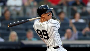 NEW YORK, NEW YORK - AUGUST 12: Aaron Judge #99 of the New York Yankees hits a solo home run in the first inning against the Minnesota Twins at Yankee Stadium on August 12, 2025 in the Bronx borough of New York City. Elsa/Getty Images/AFP (Photo by ELSA / GETTY IMAGES NORTH AMERICA / Getty Images via AFP)
