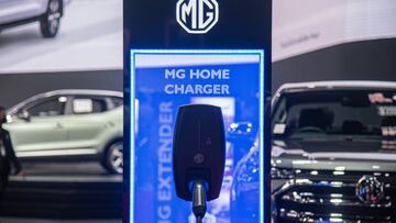 BANGKOK, THAILAND - 2022/08/19: A MG Home charging component is displayed next to a vehicle during the event. The Thailand Big Motor Sale 2022 runs from the 19 to 28 August 2022 at BITEC Bangna in Bangkok. The event showcases 17 car and 4 motorcycle brands as well as electric vehicles in the hope of boosting sales in Third Quarter of the year. (Photo by Peerapon Boonyakiat/SOPA Images/LightRocket via Getty Images)