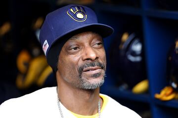 Snoop Dogg has been regularly spotted at sporting events and threw the first pitch before the MLB game between the Milwaukee Brewers vs Cincinnati Reds on Saturday. 